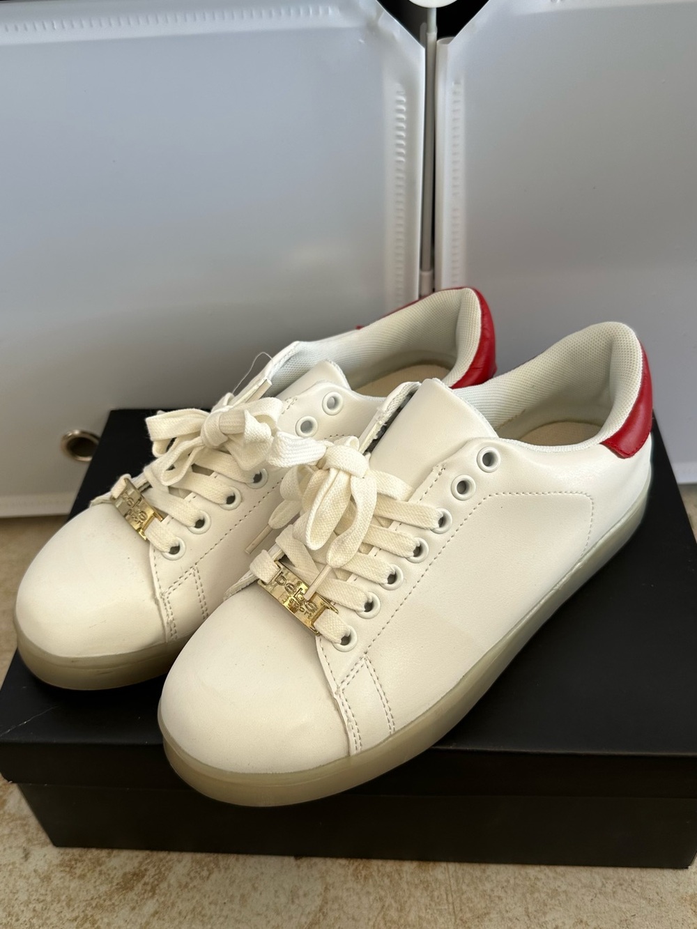 bebe White Sneakers with Red Heel Tab and Gold Hardware
